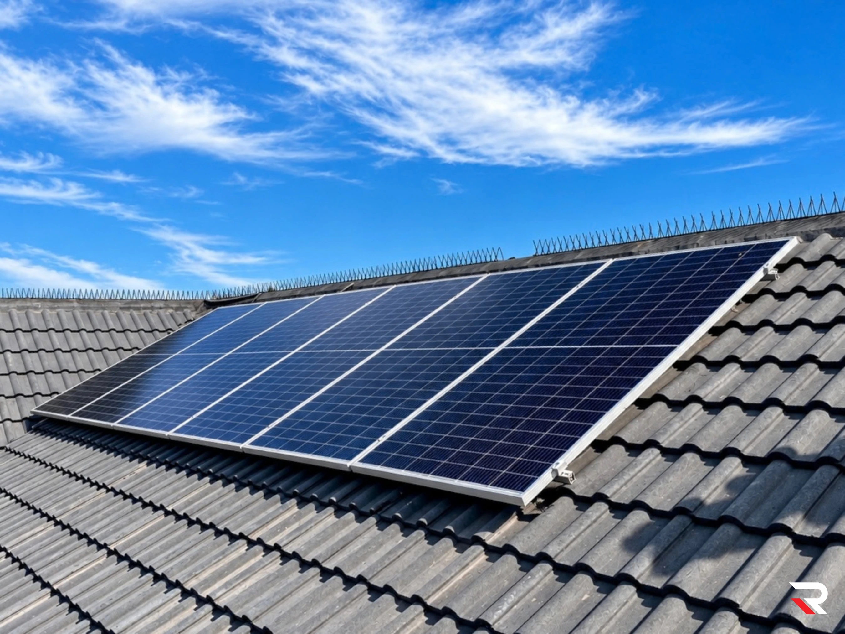 Completed roof-mounted photovoltaic panels on tiled roof
